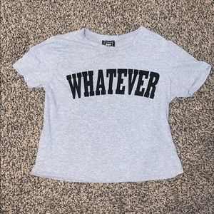 A gray shirt that says “whatever”